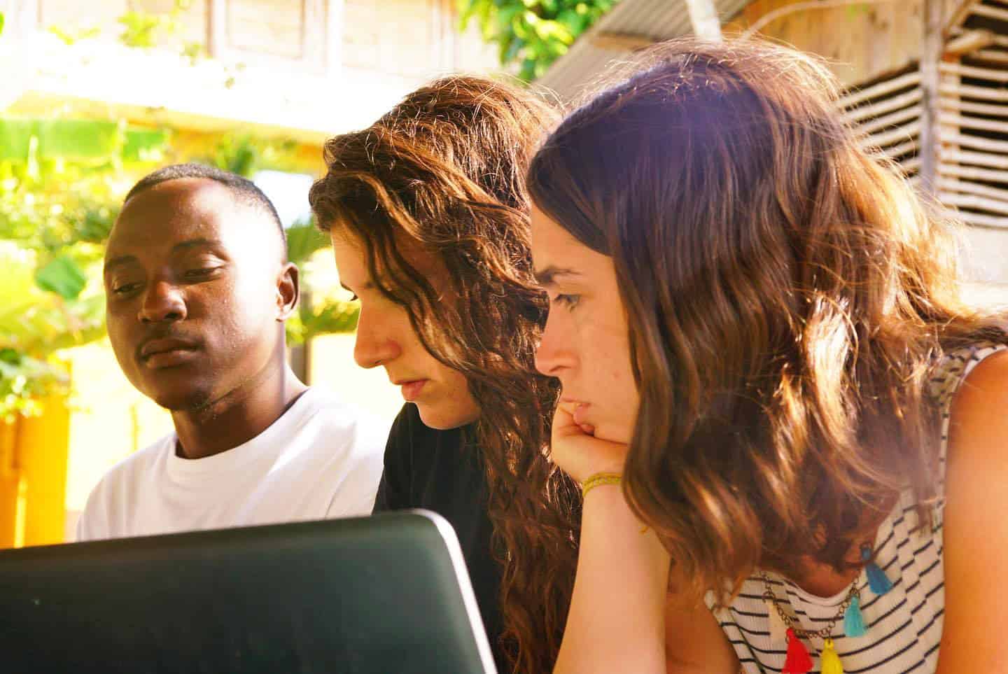 Interns engaged in marketing and management tasks as part of volunteering and internships that promote sustainable business in Tanzania.
