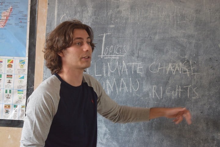 A volunteer teaching about climate change and human rights as part of a disaster management internship and environmental advocacy program in Tanzania.