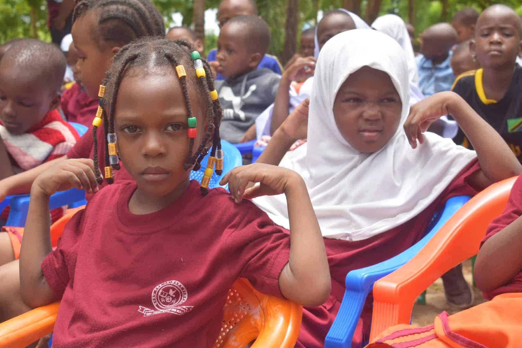 Children attending an advocacy seminar on human rights as part of a volunteering and internships initiative in Tanzania.